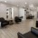 a room with black leather chairs and modern decor