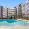 a pool in a courtyard between buildings