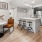 a kitchen with a table and chairs
