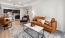 a living room with a couch and a dining table