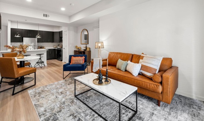 Find your perfect fit at The Lookout O4W a living room with a couch and a dining table