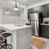 a kitchen with black cabinets