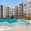 a pool in a courtyard between buildings