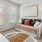 a living room with a couch and a fan