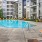 a swimming pool in a courtyard between buildings
