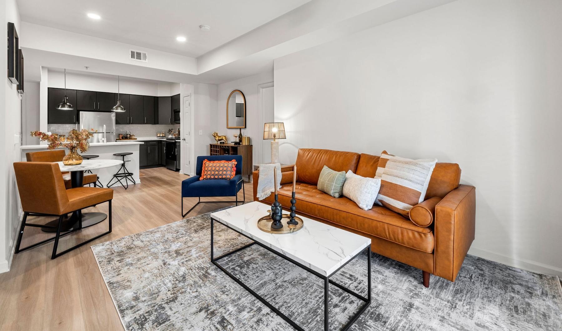 Find your perfect fit at The Lookout O4W a living room with a couch and a dining table