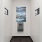 a hallway with a door and a painting on the wall